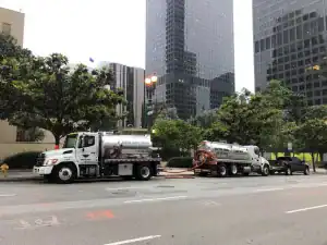 All In Sanitation septic pumping trucks providing service in downtown Los Angeles.